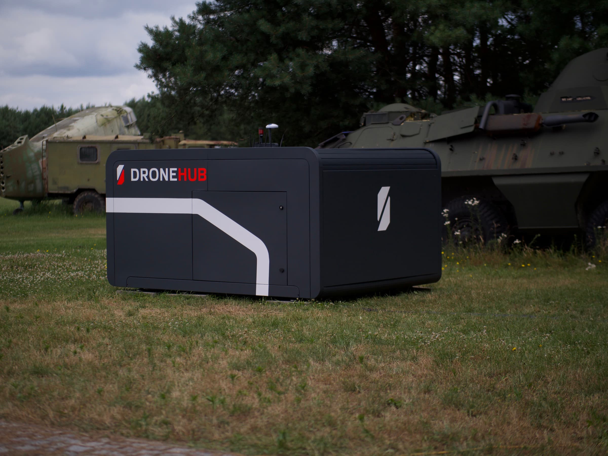 A Dronehub stationary monitoring hub sited outdoors for autonomous perimeter and inspection missions.