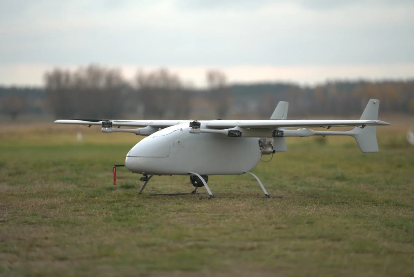 S-2 Combat Drone side profile — fixed-wing airframe with the pusher propeller at the tail.